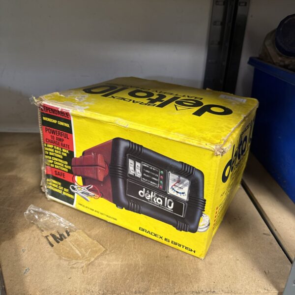Vintage Bradex Delta 10 car battery charger with original packaging.