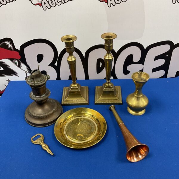 Vintage brass candlesticks with copper horn and oil lamp base.