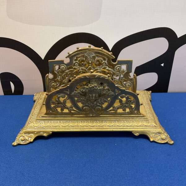 Vintage brass cherub letter rack for desk organisation.