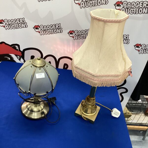 Pair of vintage brass table lamps with cream shades.