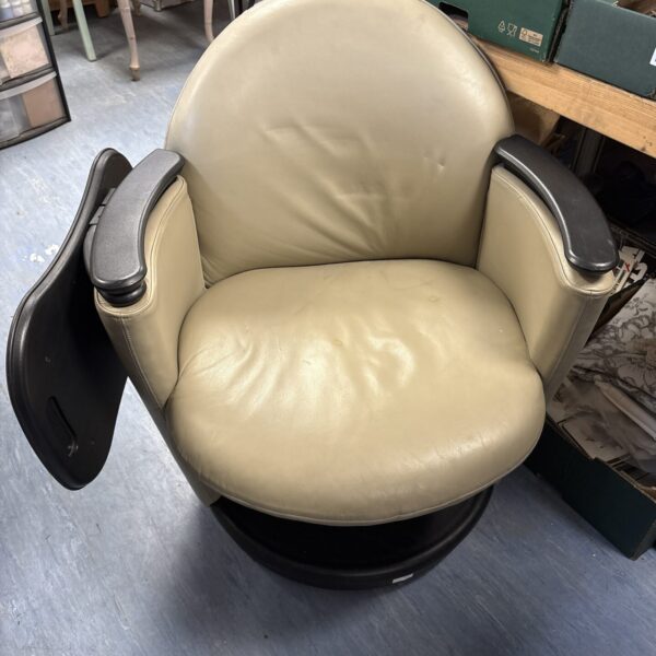 Cream vinyl office swivel chair by Brayton International.