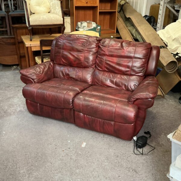 Vintage brown leather two seater sofa for sale.