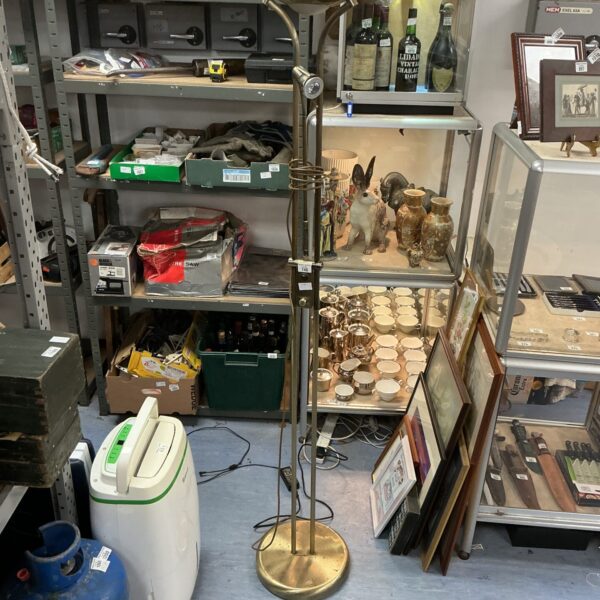 Vintage brushed metal uplighter with adjustable reading light.