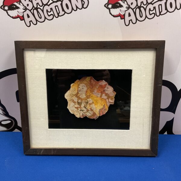 Framed fragment of a Buddhist temple painting with intricate designs.