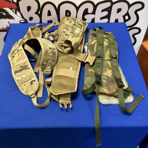 Tactical camelback hydration pack and combat vest setup.