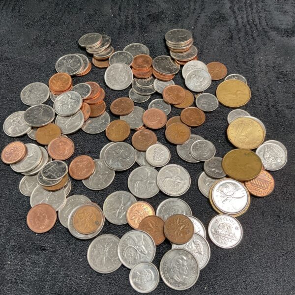 Bulk lot of Canadian coins for collectors and currency enthusiasts.