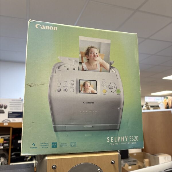 Canon Selphy ES250 compact photo printer in a vintage style.