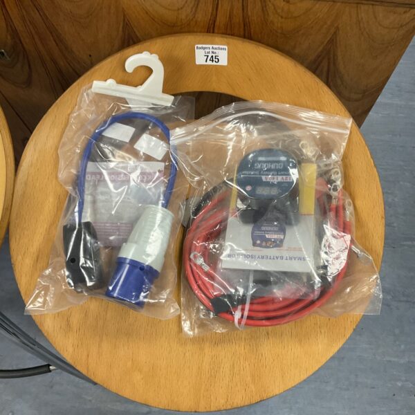 New caravan battery isolator kit with UK plug adapter for 12v systems.
