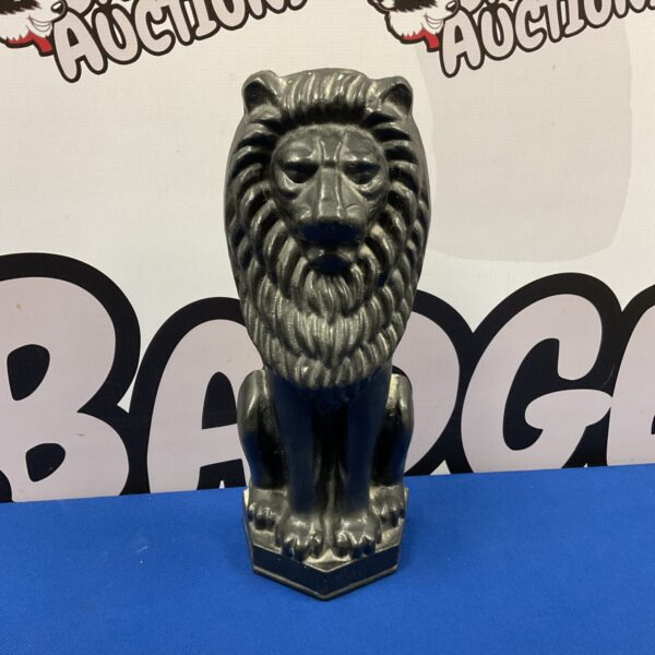 Vintage cast iron lion doorstop with detailed mane and features.