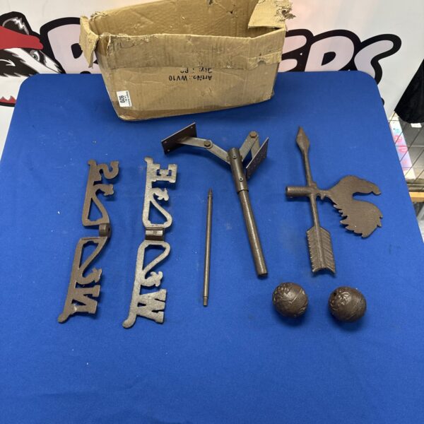 Vintage cast iron rooster weathervane for garden or farmhouse decor.