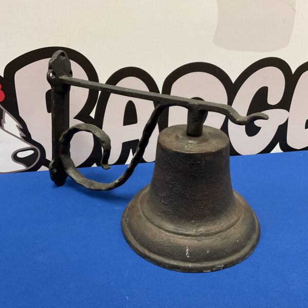 Vintage cast iron wall bell for farmhouse decor.