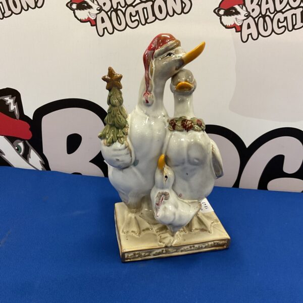 Vintage ceramic goose family figurine for seasonal home decor.