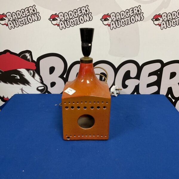 Unique sculptural ceramic table lamp with textured finish.