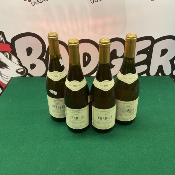 Lot of four vintage Chablis wine bottles.