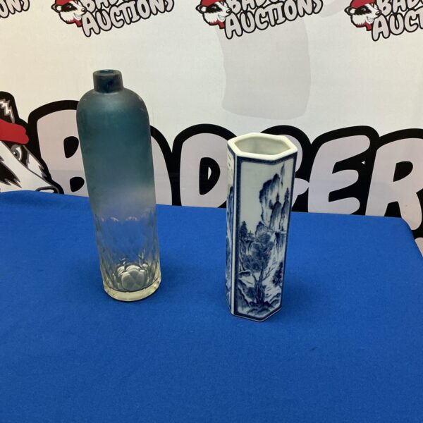 Antique Chinese blue and white porcelain bottle vase with detailed artwork.