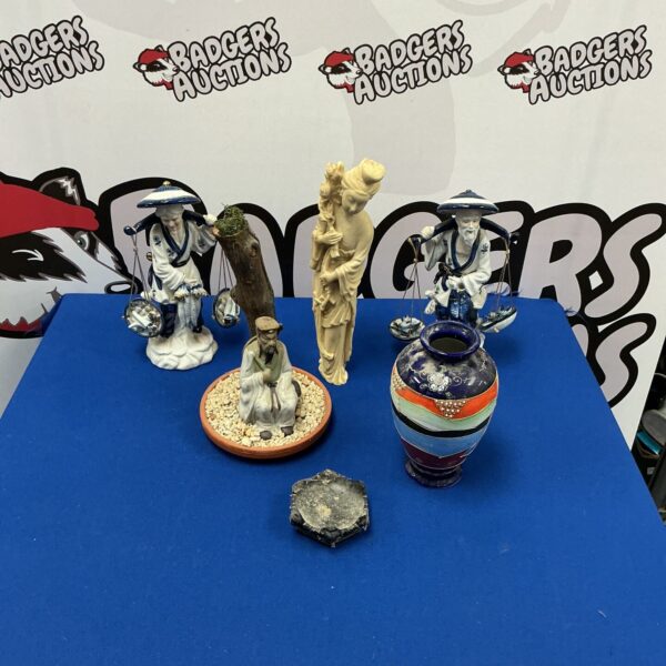 Vintage Chinese porcelain figurines displayed on a surface.