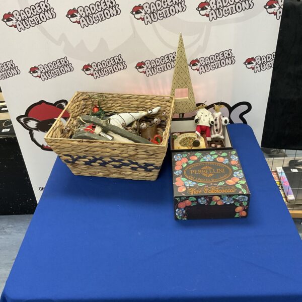 Woven basket filled with vintage Christmas decorations and ornaments.