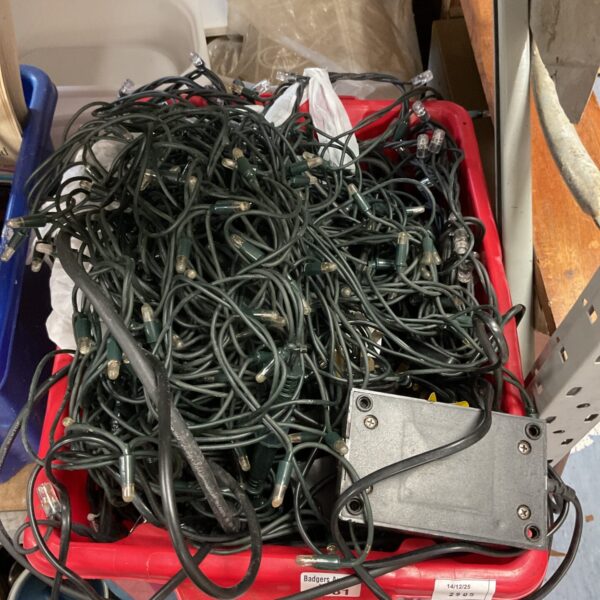 Bundle of colourful outdoor Christmas lights for festive garden decoration.