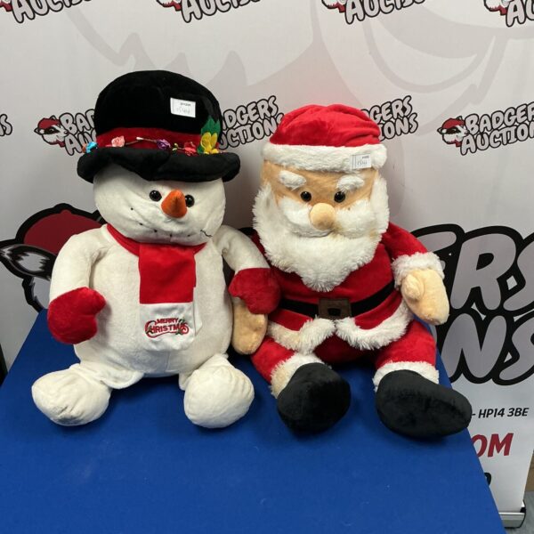 Christmas soft toys featuring Santa Claus and a snowman.