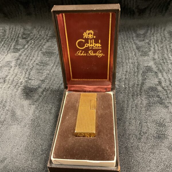 Vintage Colibri gas cigarette lighter in its original presentation case.