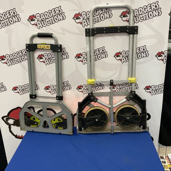 Pair of used collapsible hand trucks for moving and storage.