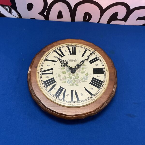 Vintage Connecticut Quartz wall clock with minimalist design.