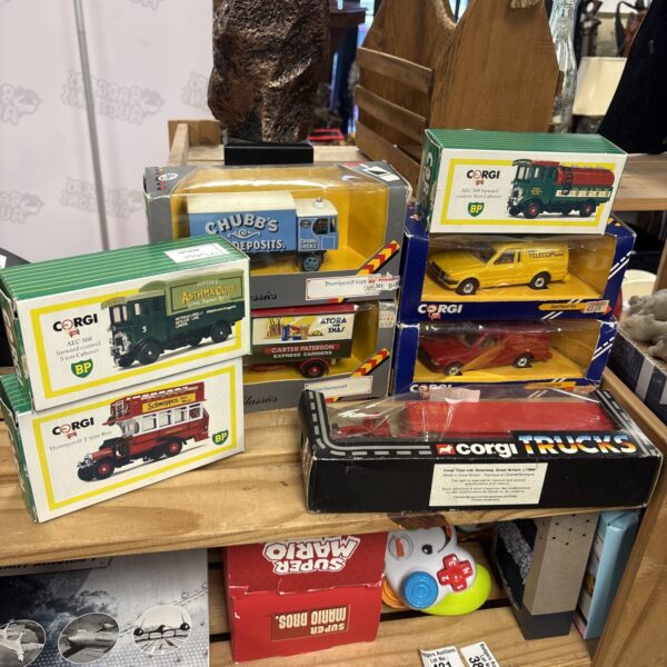 Boxed Corgi diecast models in a vintage toy lot.