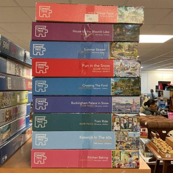 Collection of Corner Piece jigsaw puzzles in original boxes.