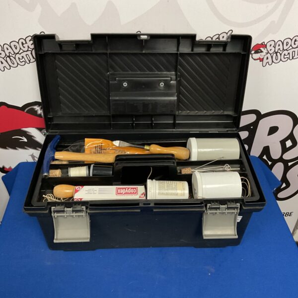 Front view of a vintage Curver plastic toolbox with a handle.