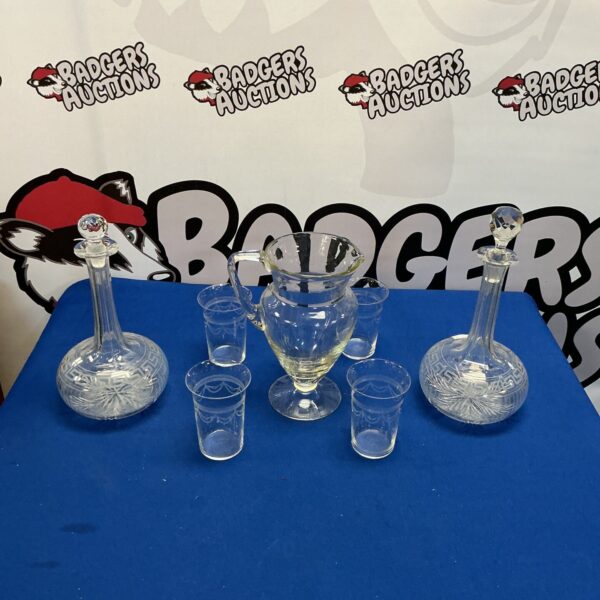Vintage cut glass decanter set with tumblers, elegant barware.