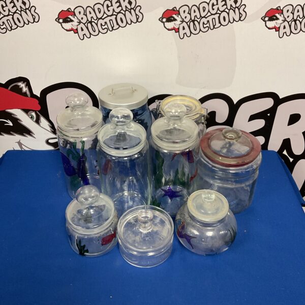 Mixed lot of decorative glass jars with colourful designs.