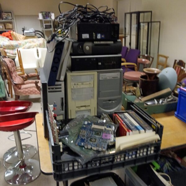 Desktop computer lot with towers and hardware components.