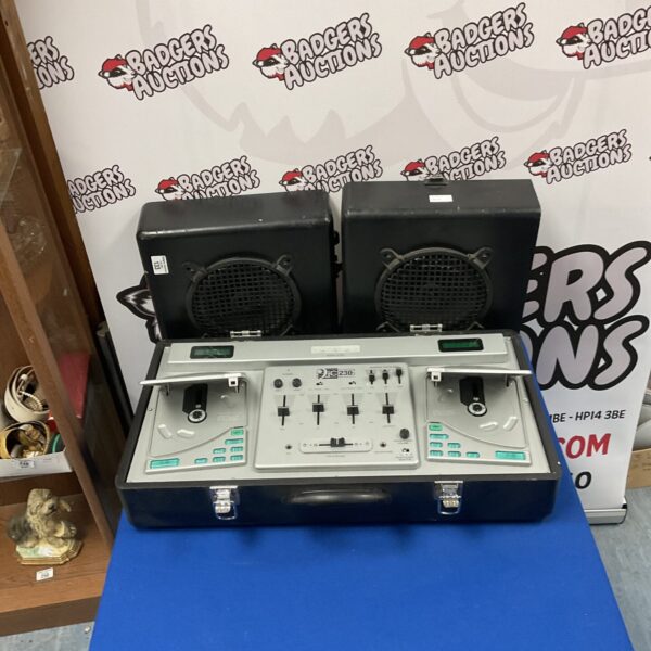 Vintage DJC 230 CD DJ console with speakers for music mixing.