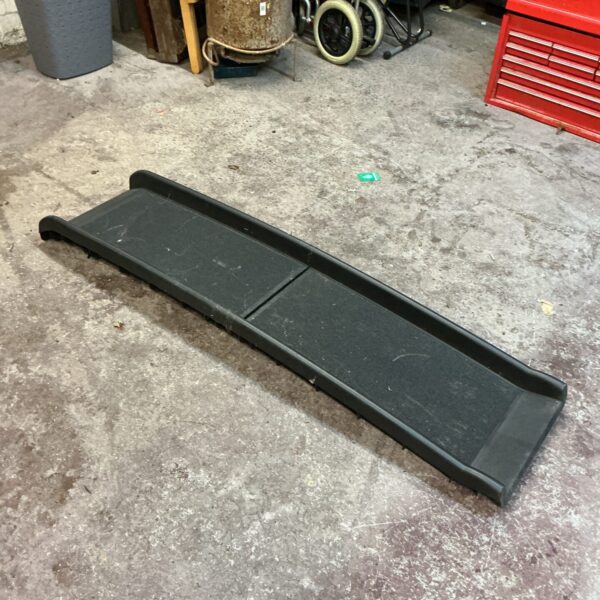 Plastic dog car ramp for easy vehicle access.