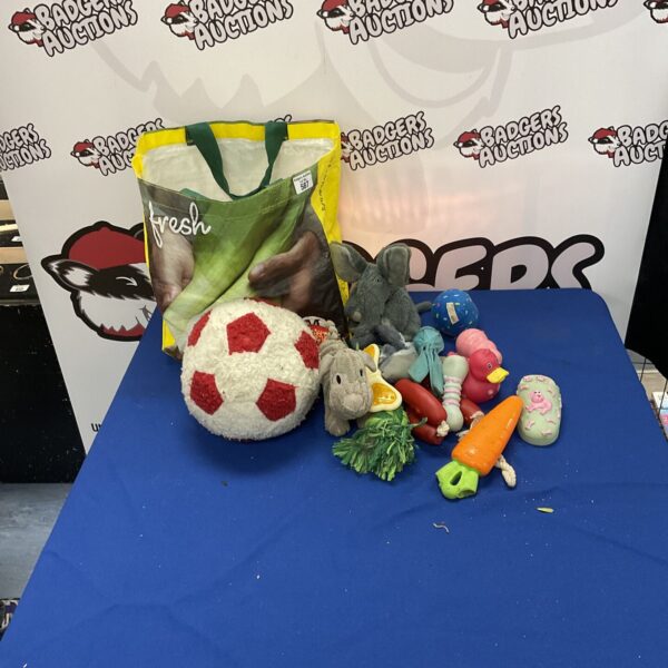 Assortment of dog toys including plush and rope options.