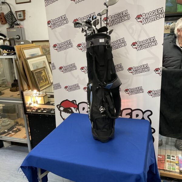 Vintage Dunlop golf club set with bag, classic retro design.