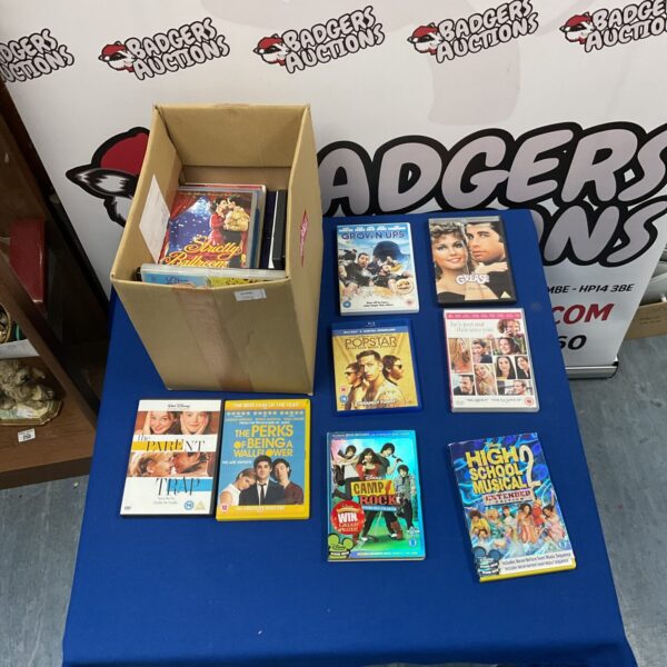 Box of assorted DVD films for home entertainment.