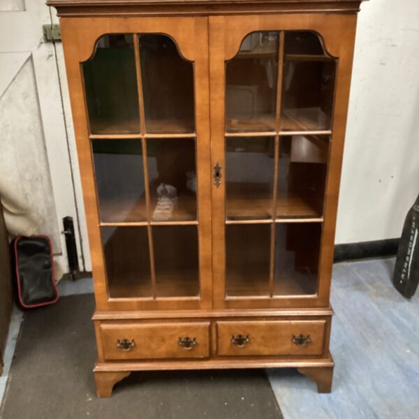 Antique Edwardian oak display cabinet with glass front and single drawer.