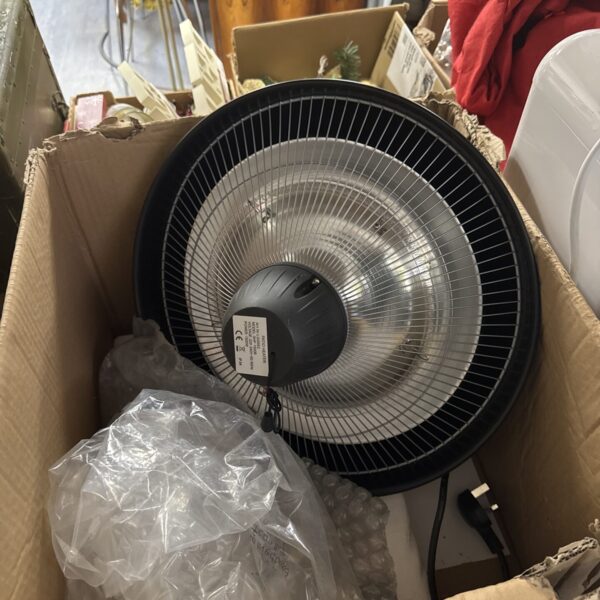 Used electric patio heater with protective cage and three pin plug.