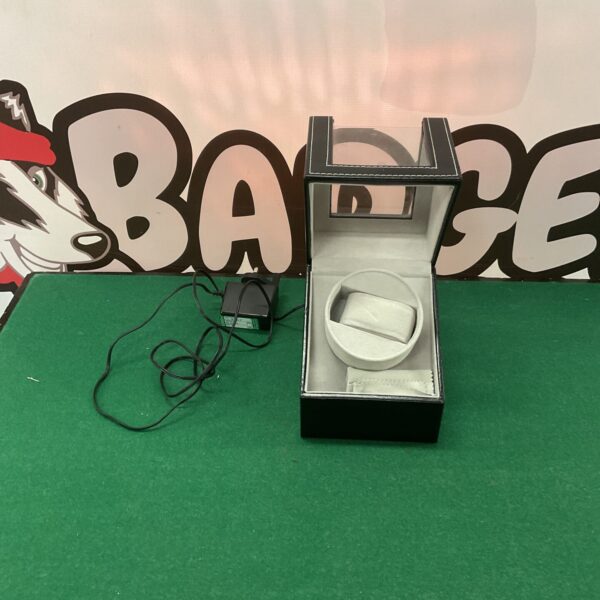 Black electric watch winder for automatic timepieces.