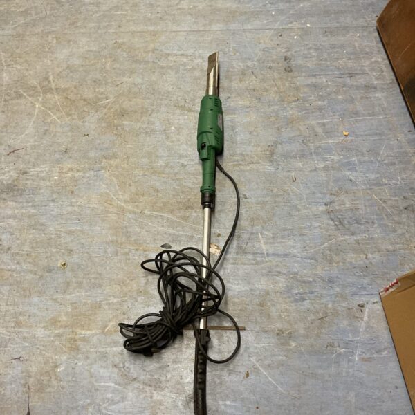 Long-handled electric weed burner for garden weed control.