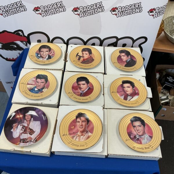 Collection of Elvis Presley collectible ceramic plates with certificates.
