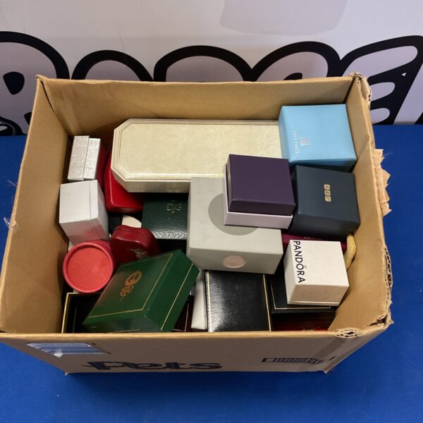 Lot of empty ring boxes including Pandora branding for jewellery display.