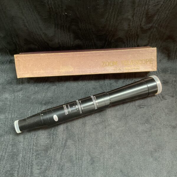 Vintage Enbeeco spotting scope with zoom function for detailed observation.