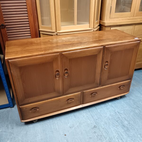 Vintage ercol sideboard in beechwood, classic mid-century modern design.