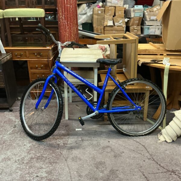 Blue vintage Falcon Manhattan mountain bike with 26 inch wheels.