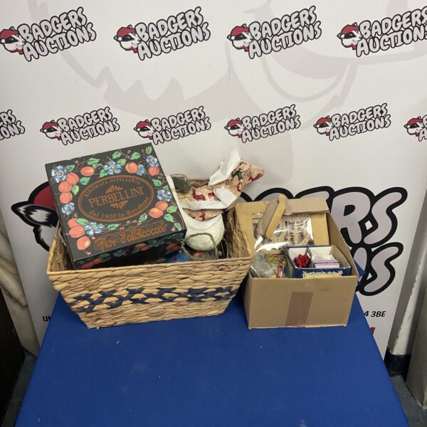 Festive holiday lot with basket and box of decorations.