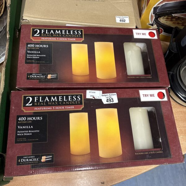 Pair of flameless real wax candles for home decor.