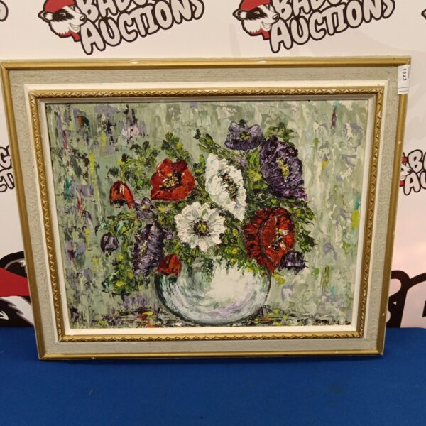Vibrant floral still life oil painting in a frame.