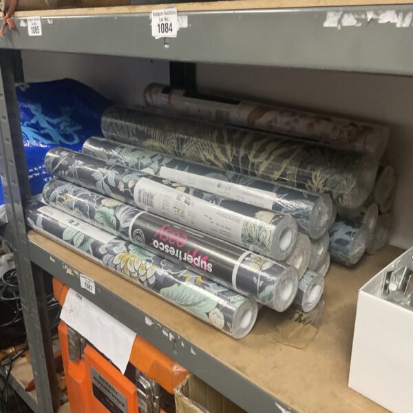 Quantity of new floral wallpaper rolls for home decoration.